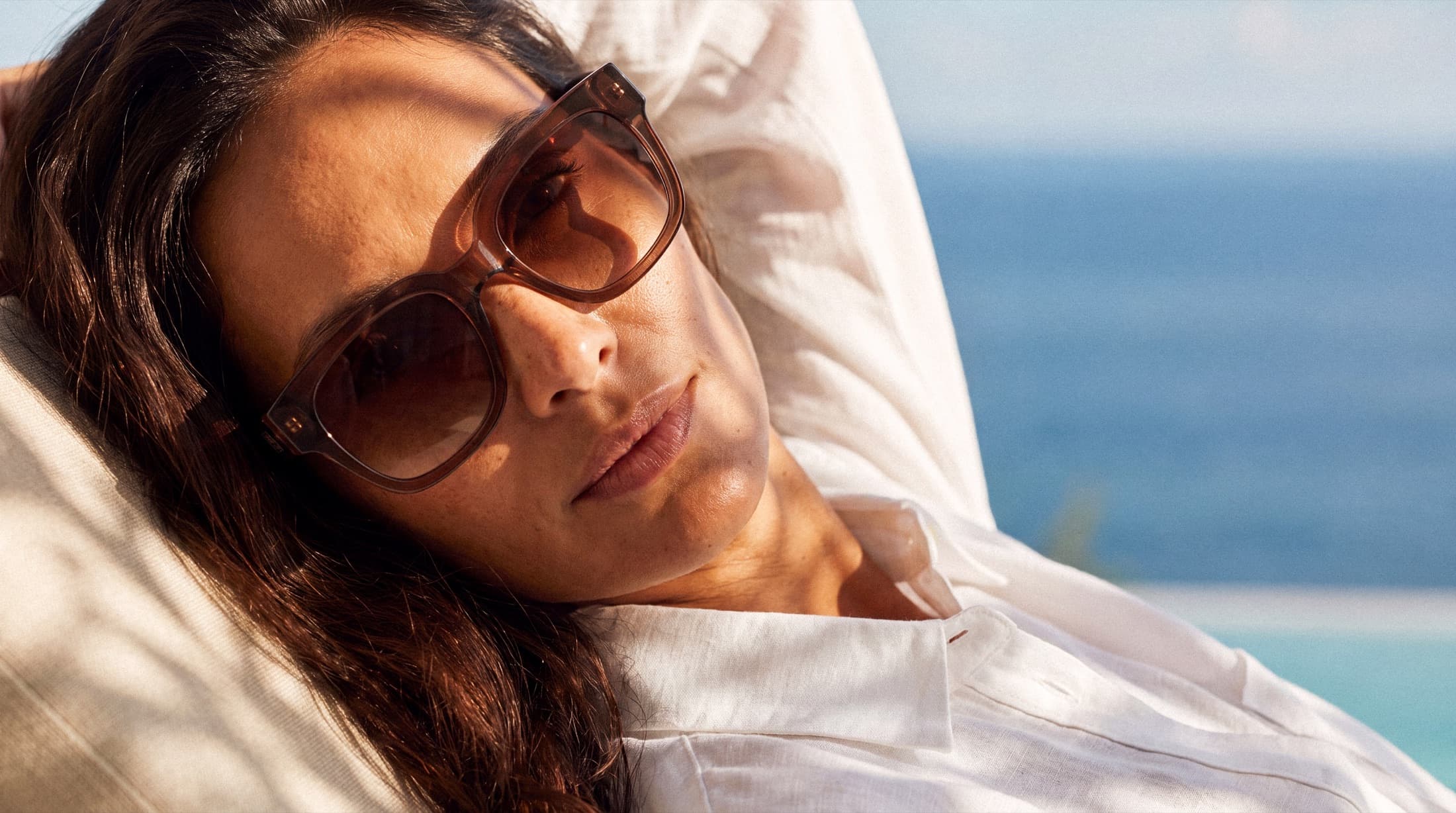 Finished eyewear campaign image in a coastal setting